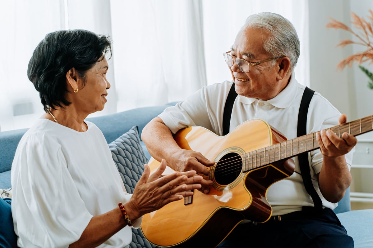 Elderly Couple Singing on the Couch